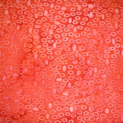 rødt balibatik stof med aflange cirkler